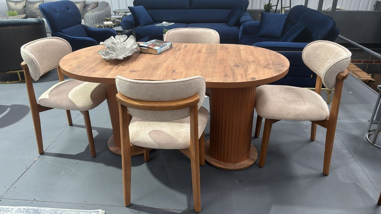 Elowen Classic Table Set with oval wooden table and four beige upholstered chairs.
