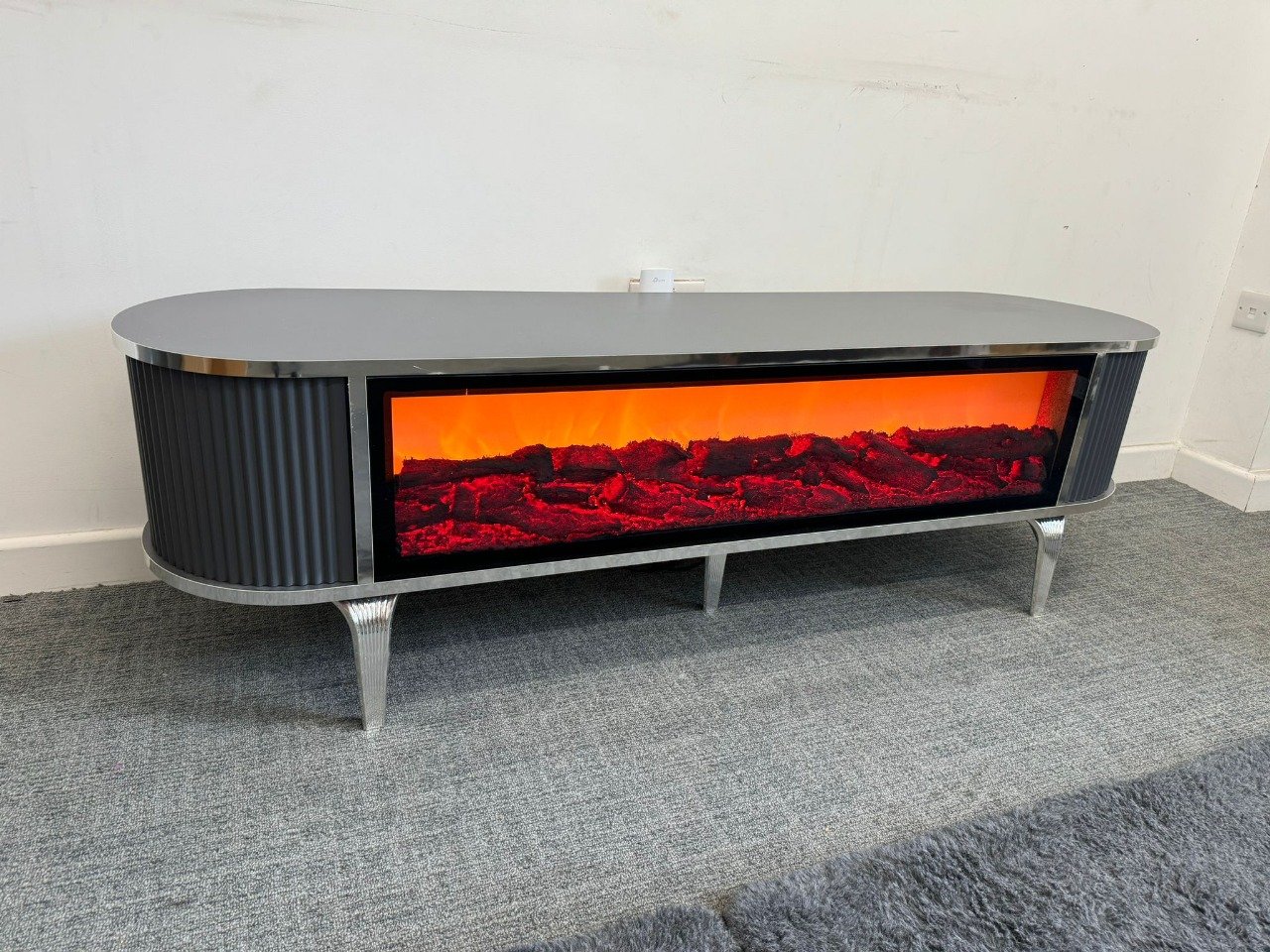 IgnisView TV Stand with built-in electric fireplace and metallic accents.